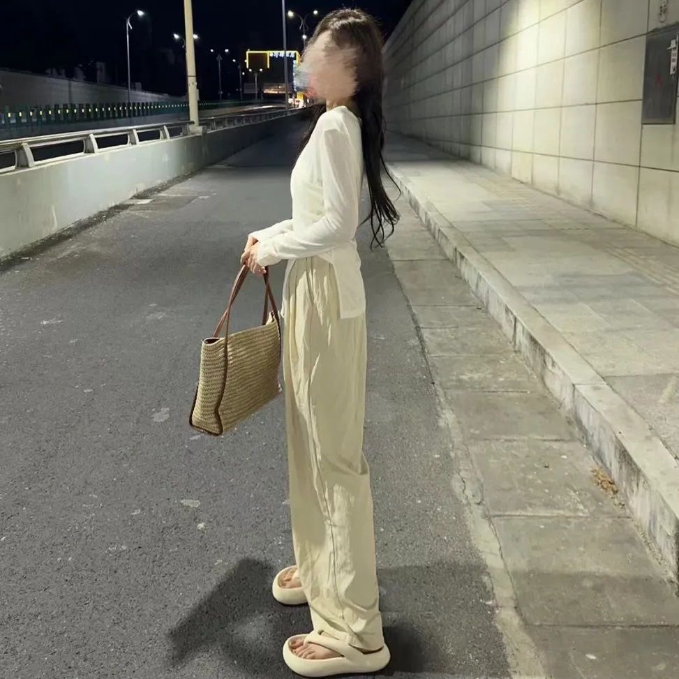 The same irregularly split long-sleeved shirt high waist wide leg drop trouser suit
