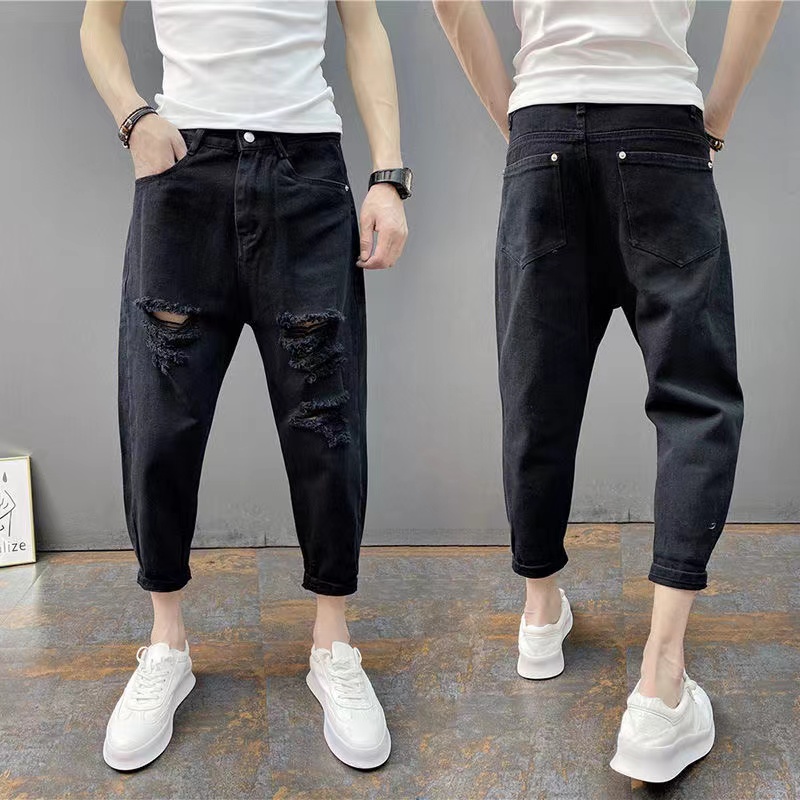The new men's ripped jeans trend loose capri pants slim legs pants all the tie leg pants